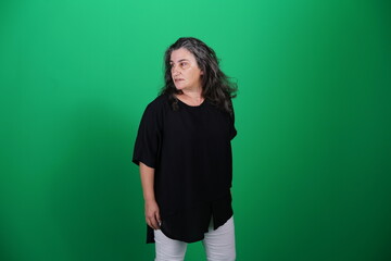 Unedited Portrait of Woman’s Face Expressing Various Emotions – Green Studio Background