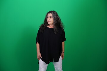 Unedited Portrait of Woman’s Face Expressing Various Emotions – Green Studio Background