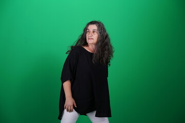 Unedited Portrait of Woman’s Face Expressing Various Emotions – Green Studio Background
