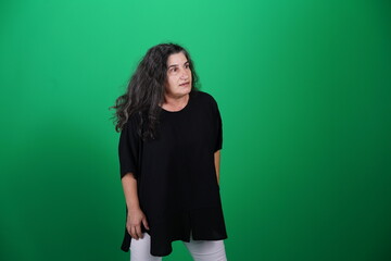 Unedited Portrait of Woman’s Face Expressing Various Emotions – Green Studio Background