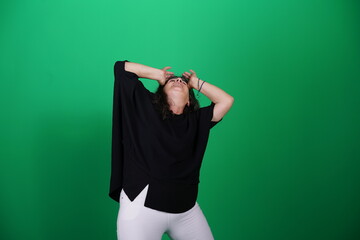 Unedited Portrait of Woman’s Face Expressing Various Emotions – Green Studio Background