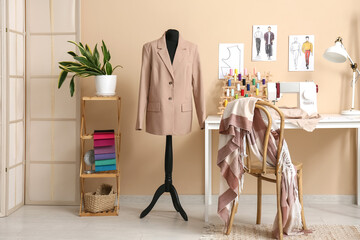 Interior of atelier with tailor's workplace and mannequin