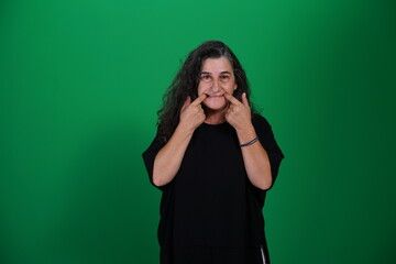 Unedited Portrait of Woman’s Face Expressing Various Emotions – Green Studio Background