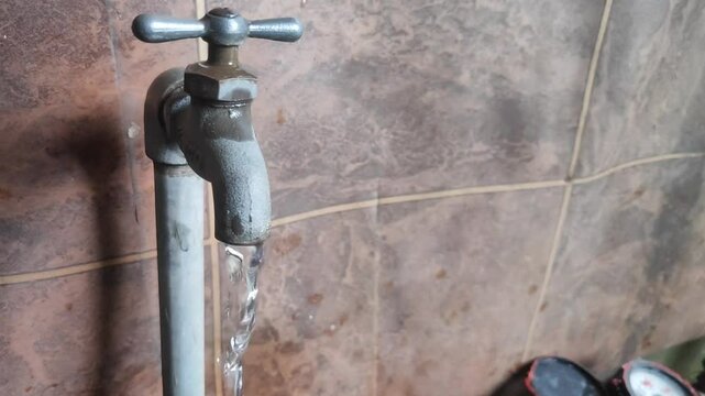 water flowing from the tap, clear and clean for daily household needs, humans depend on water for life