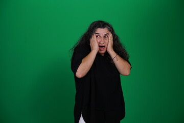 Unedited Portrait of Woman’s Face Expressing Various Emotions – Green Studio Background