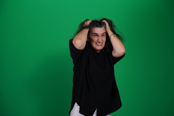 Unedited Portrait of Woman’s Face Expressing Various Emotions – Green Studio Background