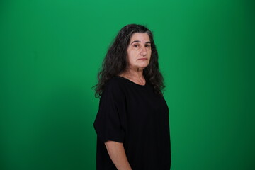 Unedited Portrait of Woman’s Face Expressing Various Emotions – Green Studio Background