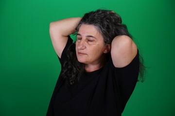Unedited Portrait of Woman’s Face Expressing Various Emotions – Green Studio Background