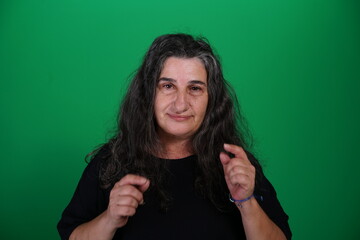 Unedited Portrait of Woman’s Face Expressing Various Emotions – Green Studio Background