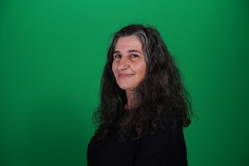 Obraz premium Unedited Portrait of Woman’s Face Expressing Various Emotions – Green Studio Background