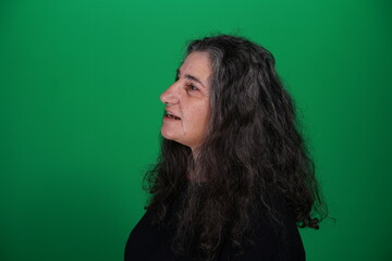 Unedited Portrait of Woman’s Face Expressing Various Emotions – Green Studio Background