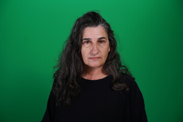 Unedited Portrait of Woman’s Face Expressing Various Emotions – Green Studio Background
