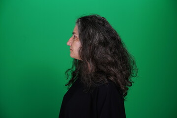 Unedited Portrait of Woman’s Face Expressing Various Emotions – Green Studio Background