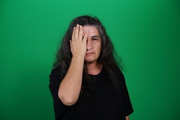 Unedited Portrait of Woman’s Face Expressing Various Emotions – Green Studio Background