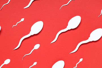 Sperm cells on red background