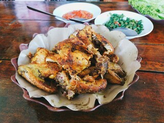 Bakakak Ayam (grilled chicken cooked using typical Indonesian spices) at Sundanese traditional...