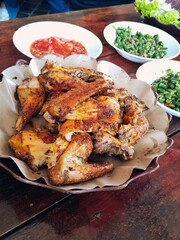 Bakakak Ayam (grilled chicken cooked using typical Indonesian spices) at Sundanese traditional...