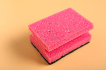 Sponge for cleaning on beige background