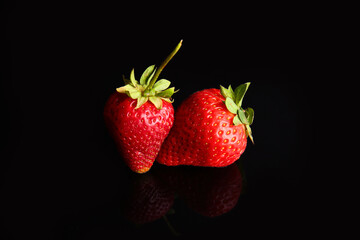 Ripe sweet strawberries on dark background