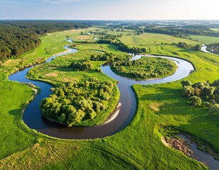Serpentine river meanders through verdant fields
