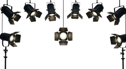 Studio Lighting Fixtures Arranged on Black Backdrop