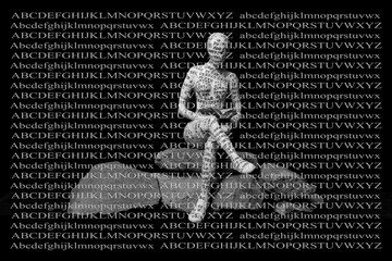 Small figurines covered in letters reading books