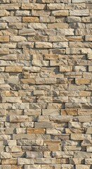 Fototapeta premium Beige stone veneer wall displays textured surface, creating an attractive and durable exterior cladding showcasing natural colors.