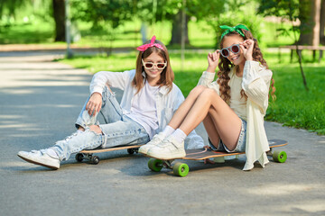 two girls on skateboards