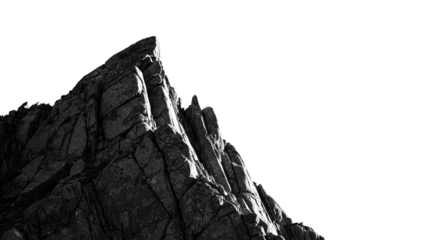 Striking monochrome showcases a jagged mountain peak against a contrasting black background creating a dramatic outdoor landscape.