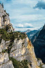 Fototapeta premium Misty Canyon View with Zip Line Station from Balagezong Scenic Area in Diqing, China