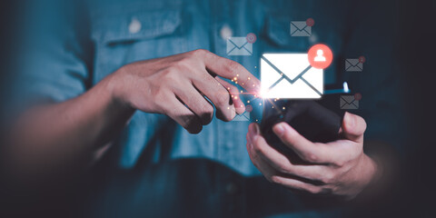 man reading electronic mail ,Email marketing and newsletter concept,Digital communication with email messages,Sending and receiving messages online with the email icon ,notifications