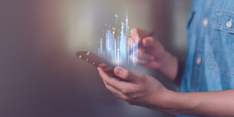 Businessman showing business growth and success graph ,concept of progress in development, financial efficiency and investment with business strategy for goals and opportunities in the industry future