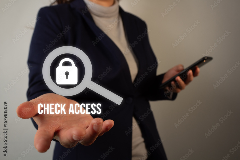 Poster executive holding a virtual icon of a padlock with a magnifying glass and the word check access