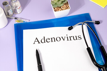 A Paper with “Adenovirus” Title in Clipboard Set on the Desk with Stethoscope – Respiratory...