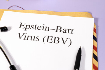 A Paper with “EBV Virus” Title in Clipboard Set on the Desk with Stethoscope – Epstein-Barr...
