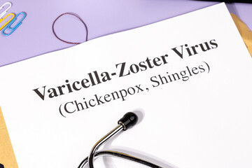 A Paper with “Varicella-Zoster Virus” Title in Clipboard Set on the Desk with Stethoscope –...