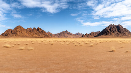 Fototapeta premium Vast desert landscape with jagged peaks clear blue sky, showcasing natural beauty