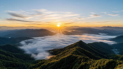 Breathtaking sunrise over mountain ridges with fog rolling valleys, creating serene atmosphere