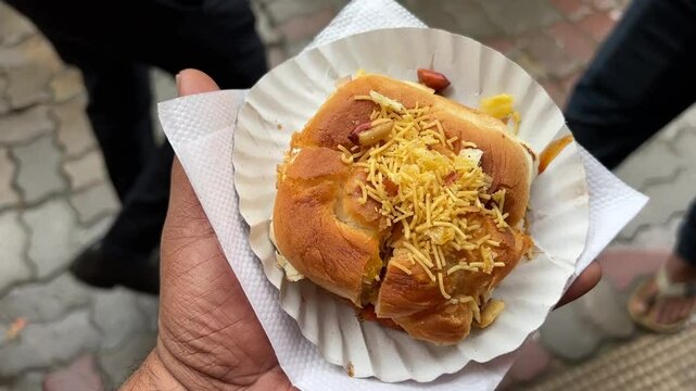 Close up shot of Vada pao sold in the streets of India.
