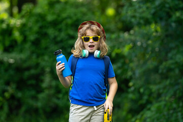 Child on picnic or nature trip in summer. Kid Fun on camping. Little tourist on nature. Child...