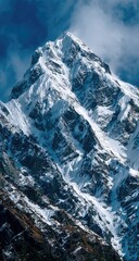 Obraz premium Snow-capped mountain peak, dramatic clouds