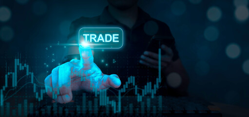 Investors trade on a virtual screen, with financial stock market statistics graphs on the screen, stock prices, and online trading data in the foreground.