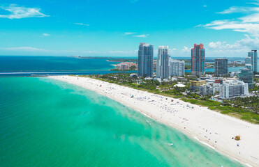Miami cityscape with luxury skyscrapers and ocean. Panoramic drone view of Miamis famous skyline....