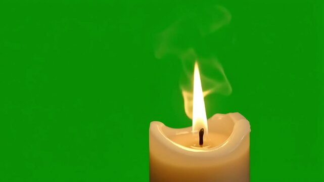 Glowing candle flame flickering against a green screen backdrop creates peaceful and relaxing atmosphere, perfect for spiritual or holiday themes. - Powered by Adobe