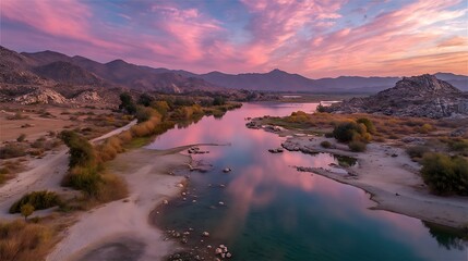 Naklejka premium River Landscape with Pink Clouds, Mountains, Rocks and Trees