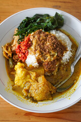 Nasi Padang Kikil, Indonesia, captured on July 13, 2025. Steamed rice served with spicy Padang-style beef tendon curry, vegetables, sambal, and rich coconut gravy for bold Minang flavor