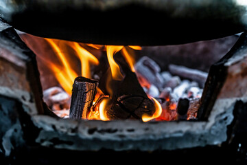 Burning charcoal firewood in the stove.