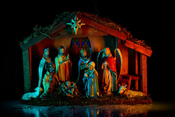 Christmas scene of born child baby Jesus Christ in the manger with Joseph and Mary.