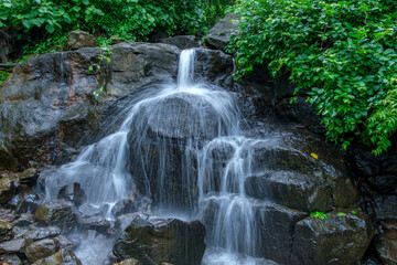 A waterfall during the monsoons near Pune India. Monsoon is the annual rainy season in India from June to September.