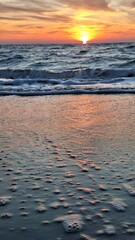 Footstep print on sand during sunset on beach, Preveza, Greece